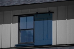 Exterior Dummy Hardware Single Shutter on Gray House With Blue Shutter