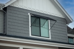 Two Panel Bahama Awning by Goldberg Brothers on Upper Floor Window of New House