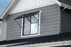 Two Panel Bahama Awning by Goldberg Brothers on Upper Floor Window of New House