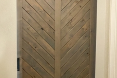 Hidden Roller Hardware on a Custom Made Barn Door With Diagonal Slats